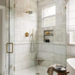 Standard bathroom remodel with frameless glass shower and quartz vanity